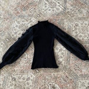 Almost Famous Elegant Black Blouse with Textured Sleeves